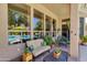 Inviting covered patio featuring comfortable seating and views of the sparkling pool through large windows at 4511 E Kirkland Rd, Phoenix, AZ 85050