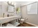 Stylish bathroom featuring a modern marble vanity, stainless steel fixtures, and updated design at 4563 E Libby St, Phoenix, AZ 85032
