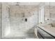 Modern bathroom featuring a tiled walk-in shower, a glass door and a double vanity sink at 4563 E Libby St, Phoenix, AZ 85032