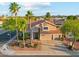 Aerial view of a desert home with a tile roof, mature trees and shrubs, and mountain views at 4563 E Libby St, Phoenix, AZ 85032