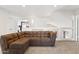 Spacious upper-level living room features neutral carpet and is illuminated by natural light at 4563 E Libby St, Phoenix, AZ 85032