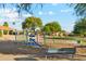 Neighborhood playground with swings and play structure surrounded by lush landscaping at 4563 E Libby St, Phoenix, AZ 85032