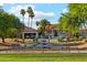 Community playground with a variety of equipment, palm trees, and lush landscaping in a quiet neighborhood at 4563 E Libby St, Phoenix, AZ 85032