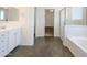 Clean and modern bathroom featuring a bathtub, shower, and vanity with generous counter space at 4990 E Odessa Dr, San Tan Valley, AZ 85140