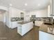 Spacious kitchen featuring granite countertops, stainless steel appliances, and ample cabinet space at 4990 E Odessa Dr, San Tan Valley, AZ 85140