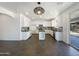 Open concept kitchen showcasing white cabinetry, an island, and stainless steel appliances at 4990 E Odessa Dr, San Tan Valley, AZ 85140