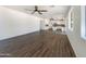 Open-concept living room featuring hard floors, white walls and kitchen view at 4990 E Odessa Dr, San Tan Valley, AZ 85140