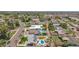 Aerial shot highlighting neighborhood streets and backyards, featuring some homes with pools and lush landscaping at 6255 E Rose Circle Dr, Scottsdale, AZ 85251