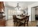 This dining room offers seating for six and views of the backyard pool area at 6255 E Rose Circle Dr, Scottsdale, AZ 85251