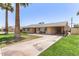 This charming home features mature landscaping and a covered carport for added convenience at 6255 E Rose Circle Dr, Scottsdale, AZ 85251