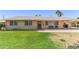 Charming single-story home features a well-maintained front yard with mature landscaping at 6255 E Rose Circle Dr, Scottsdale, AZ 85251