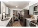 Well-organized pantry provides ample storage in this kitchen with stainless steel appliances at 6255 E Rose Circle Dr, Scottsdale, AZ 85251