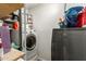 This laundry room is equipped with modern appliances and ample storage space at 6255 E Rose Circle Dr, Scottsdale, AZ 85251