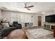 Cozy living room with hardwood floors and plantation shutters for added privacy at 6255 E Rose Circle Dr, Scottsdale, AZ 85251