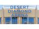 Exterior view of Desert Diamond Arena, featuring the arena name in large blue letters over the entrance at 6745 N 93Rd Ave # 1129, Glendale, AZ 85305