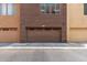 Exterior garage doors for homes with clearly marked unit numbers and neutral color schemes at 6745 N 93Rd Ave # 1129, Glendale, AZ 85305