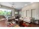 Bright living area features hardwood floors, neutral colors, and a sliding glass door to the balcony at 6745 N 93Rd Ave # 1129, Glendale, AZ 85305