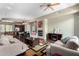 Open-concept living and dining area boasts hardwood floors, a fireplace, and seamless flow for entertaining at 6745 N 93Rd Ave # 1129, Glendale, AZ 85305