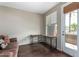 Functional living space with a built-in desk area and access to a balcony with views at 6745 N 93Rd Ave # 1129, Glendale, AZ 85305