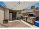 Outdoor living space with shade, grill and cooler, perfect for entertaining guests at 6802 S 47Th St, Phoenix, AZ 85042