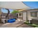 Charming backyard with a stone bar, small pool, and shaded seating area at 6802 S 47Th St, Phoenix, AZ 85042