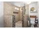 Modern bathroom featuring tiled walls, walk-in shower, and stylish fixtures at 6802 S 47Th St, Phoenix, AZ 85042