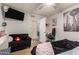 Inviting bedroom with a sofa, television, and an open doorway to another room at 6802 S 47Th St, Phoenix, AZ 85042