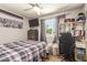 Cozy bedroom featuring a ceiling fan, neutral walls, and a window providing natural light at 6802 S 47Th St, Phoenix, AZ 85042