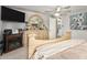Comfortable bedroom featuring a large bed, dresser, and decorative mirror at 6802 S 47Th St, Phoenix, AZ 85042
