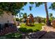 Wide angle view of backyard with lush foliage and a play area at 735 W Kelton Ln, Phoenix, AZ 85023