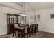 Formal dining room with a long table, upholstered chairs, and decorative hutch at 735 W Kelton Ln, Phoenix, AZ 85023