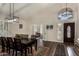 Elegant dining room with high ceilings, decorative rug and stylish light fixtures at 735 W Kelton Ln, Phoenix, AZ 85023