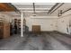 Spacious and organized garage interior with ample storage room and overhead lighting at 735 W Kelton Ln, Phoenix, AZ 85023