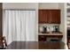 A well-lit kitchenette features dark cabinetry and appliances on the counter at 735 W Kelton Ln, Phoenix, AZ 85023