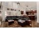 Open-concept living room featuring vaulted ceilings, a fireplace and seamless access to the kitchen at 735 W Kelton Ln, Phoenix, AZ 85023
