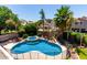 Inviting backyard with a sparkling pool, spa, lush landscaping, and a safety fence at 735 W Kelton Ln, Phoenix, AZ 85023