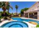 Stunning backyard with a refreshing pool, spa, rock features, mature trees, and lush landscaping at 735 W Kelton Ln, Phoenix, AZ 85023