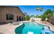 The covered patio and pool area offers a relaxing outdoor oasis with desert landscaping at 757 W Carob Way, Chandler, AZ 85248
