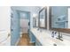 Well-lit bathroom features double sinks, neutral decor, and separate shower area at 757 W Carob Way, Chandler, AZ 85248