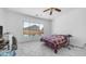 Bright bedroom features a large window with a view of the fenced in pool area at 757 W Carob Way, Chandler, AZ 85248