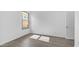 Bright bedroom with light gray flooring and a window for natural light at 757 W Carob Way, Chandler, AZ 85248