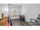 Cozy room with gray flooring, arched window with plantation shutters, and ample storage at 757 W Carob Way, Chandler, AZ 85248