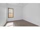 Bedroom boasts gray wood flooring and a window providing ample natural light at 757 W Carob Way, Chandler, AZ 85248