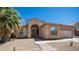 Inviting home exterior featuring desert landscaping, stucco finish, and arched entrance at 757 W Carob Way, Chandler, AZ 85248
