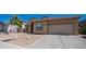 Charming one-story home with a two-car garage, desert landscaping, and a tile roof under a beautiful blue sky at 757 W Carob Way, Chandler, AZ 85248