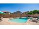 A refreshing private pool is surrounded by a beige concrete deck and block fence at 757 W Carob Way, Chandler, AZ 85248