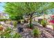 Secluded backyard oasis with a fire pit, dining area, bar, and lush landscaping for ultimate relaxation at 7635 S Taylor Dr, Tempe, AZ 85284