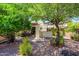 Private backyard showcasing a bar, dining area, and mature shade trees, designed for outdoor living at 7635 S Taylor Dr, Tempe, AZ 85284