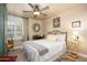 Charming bedroom with natural light, a ceiling fan, and stylish furnishings at 7635 S Taylor Dr, Tempe, AZ 85284