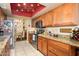 Warm kitchen featuring granite countertops, wood cabinets, and stainless steel appliances at 7635 S Taylor Dr, Tempe, AZ 85284